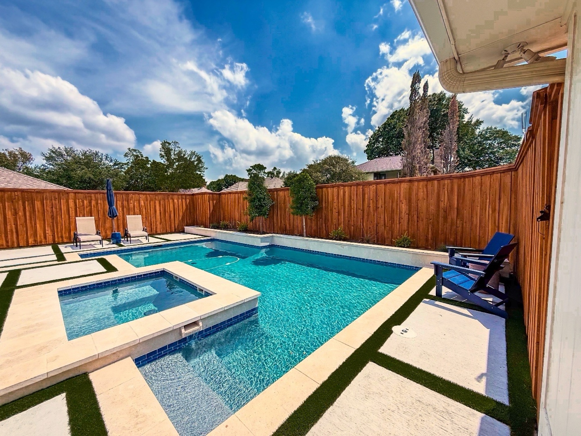 Covered patio with outdoor fireplace and custom patio furniture,