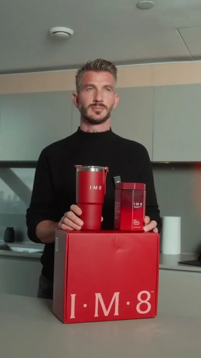 Tim Biohacker with the IM8 tumbler and Daily Essentials box.