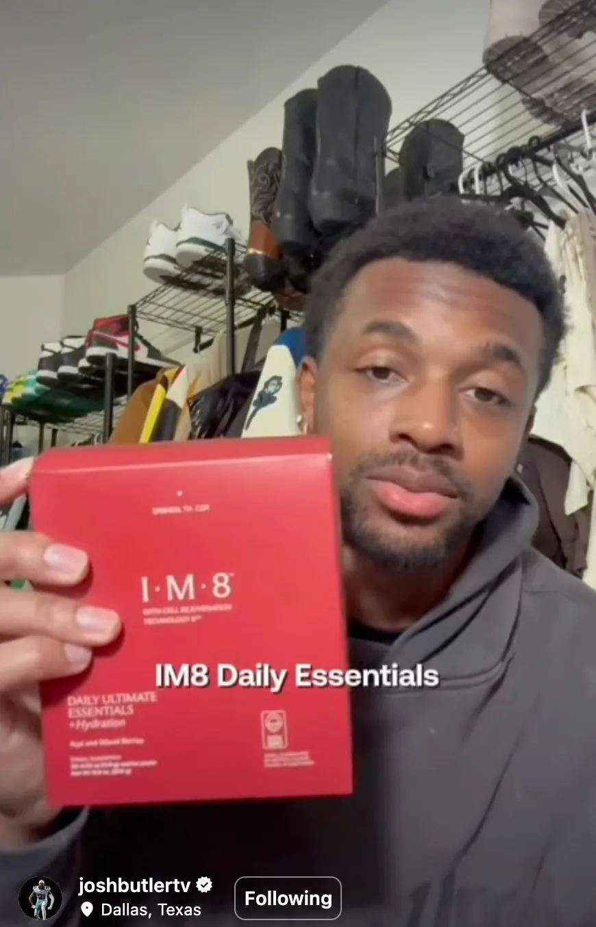 Josh Butler holding the IM8 Daily Essentials carton.