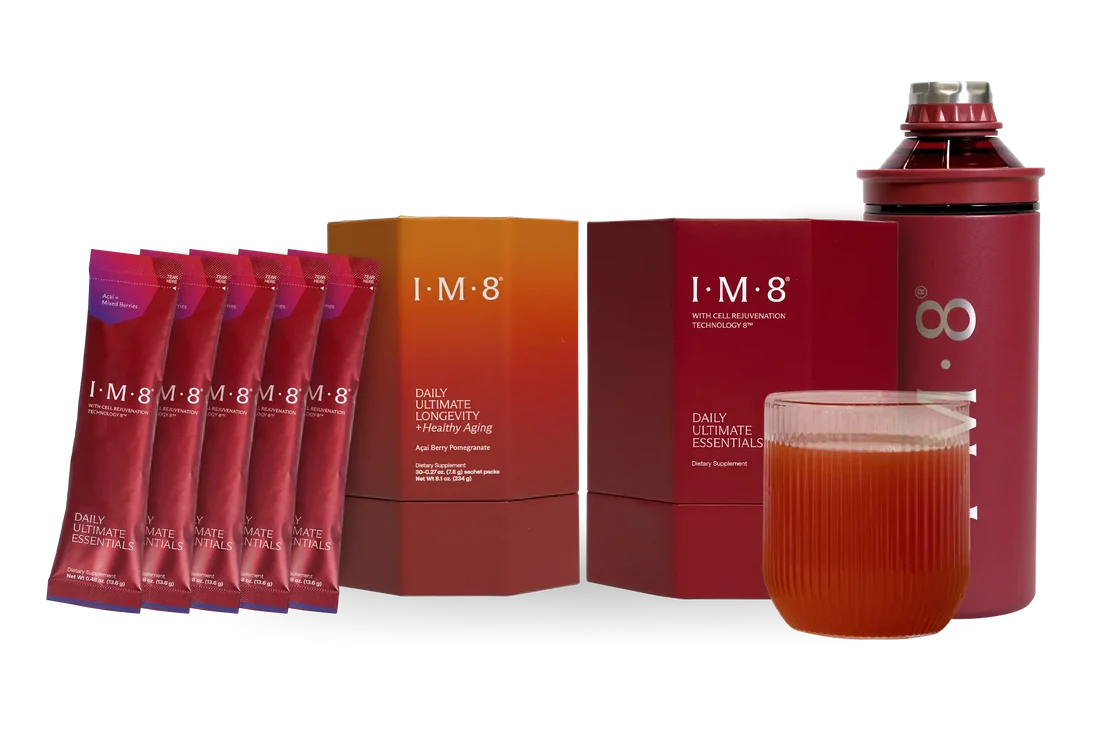 The IM8 Health system: Daily Ultimate Essentials sachets and carton, Daily Ultimate Longevity carton, branded shaker bottle and a poured glass.