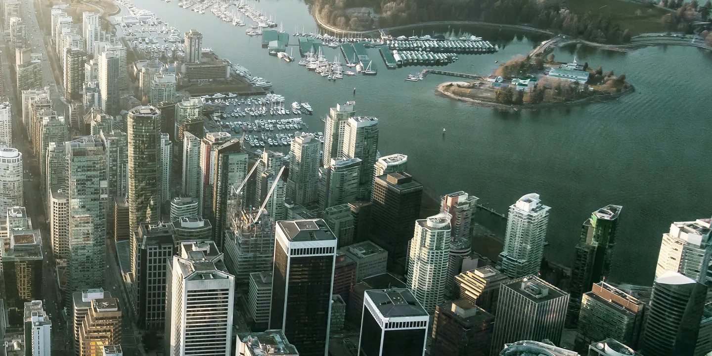 Overhead view of Vancouver's shoreline towers and private marinas.