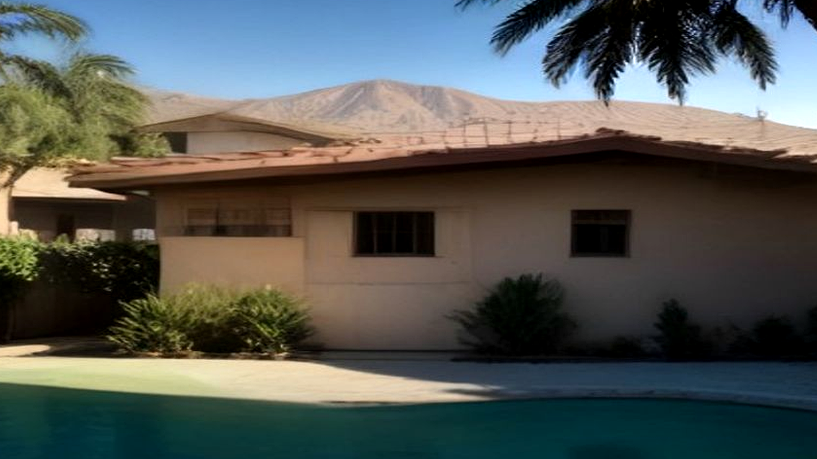 Photoreal Encino two-unit house with construction materials, no logos or text