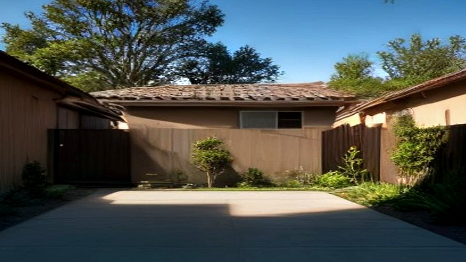Photoreal Encino two-unit house with construction materials, no logos or text
