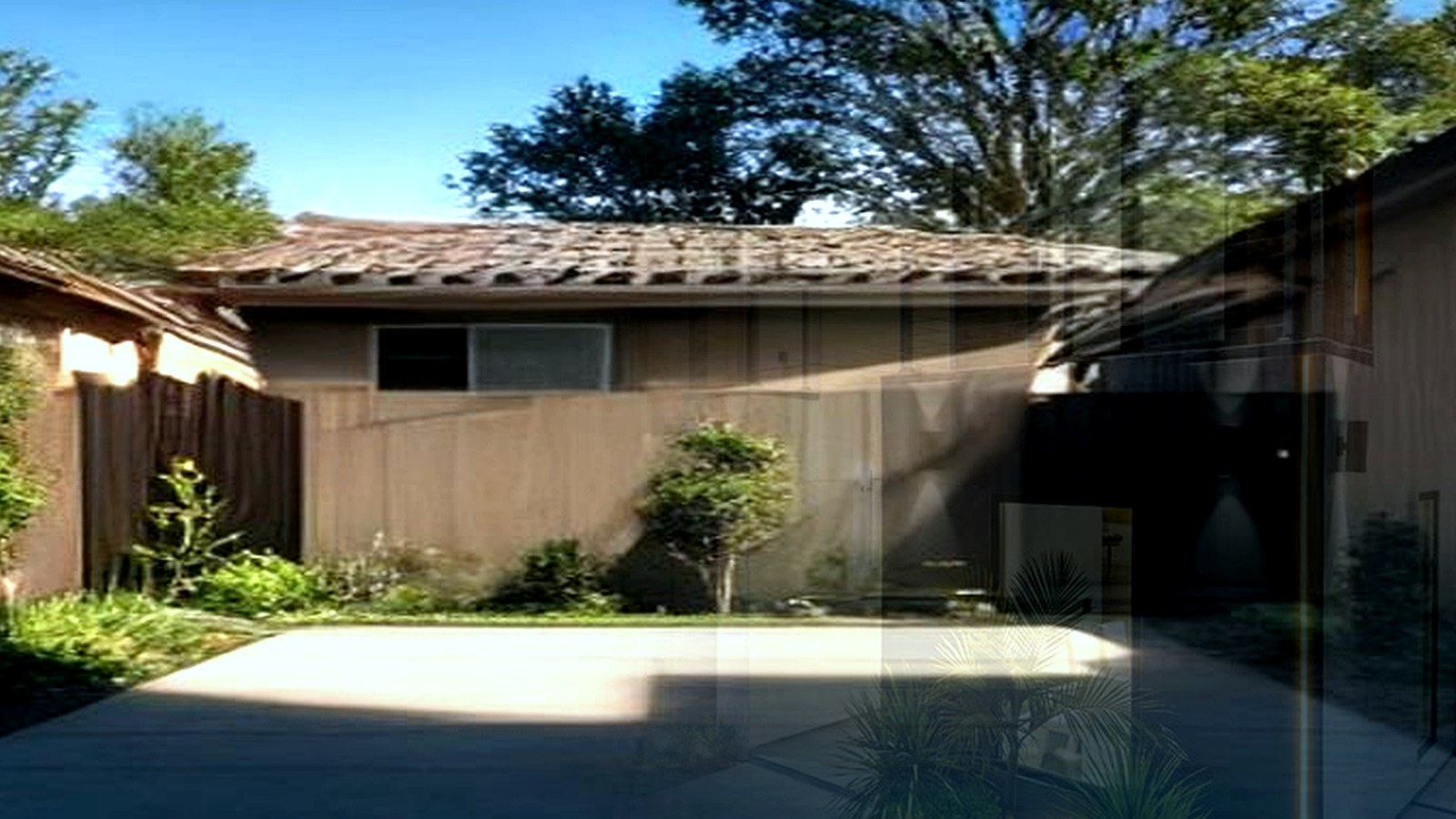 Photoreal Encino two-unit house with construction materials, no logos or text