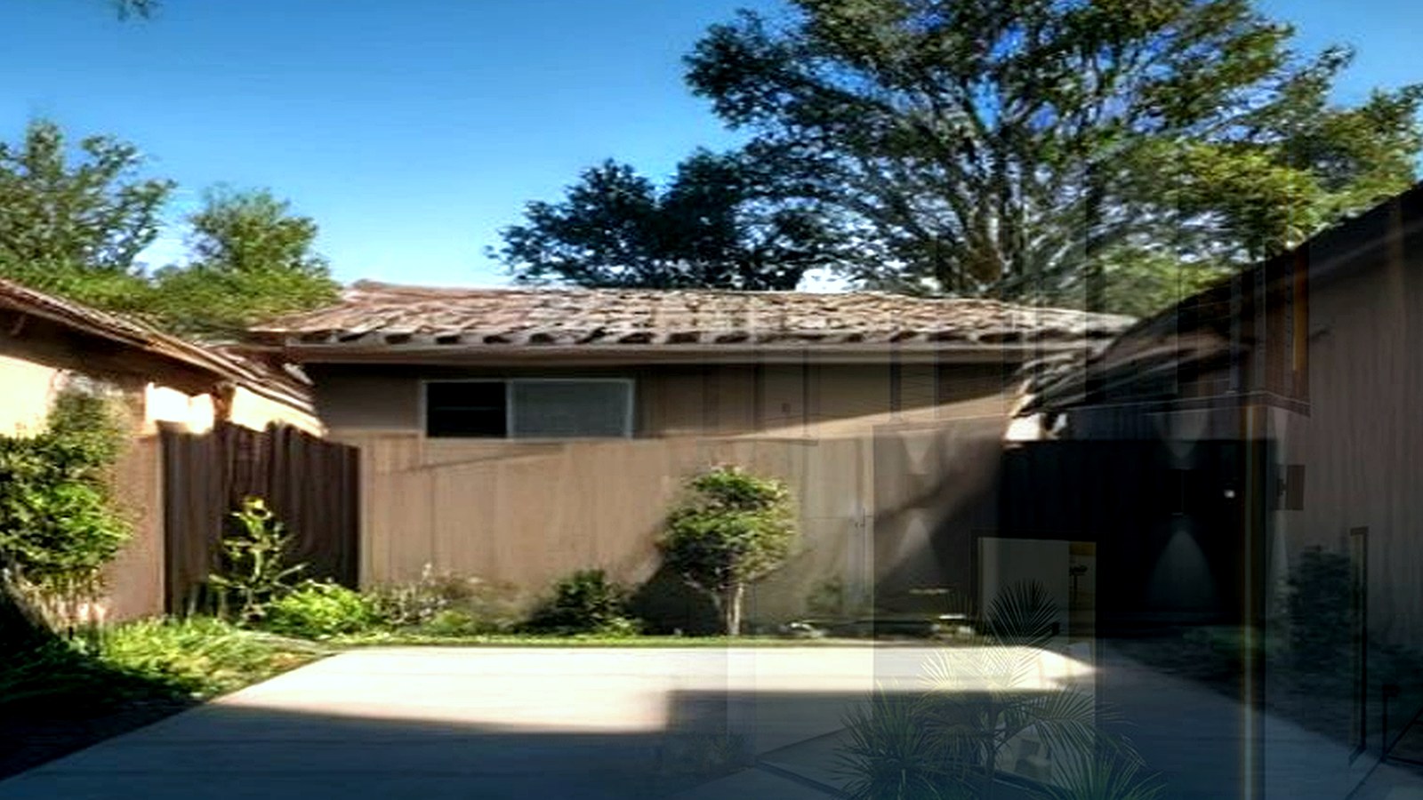 Photoreal Encino two-unit house with construction materials, no logos or text
