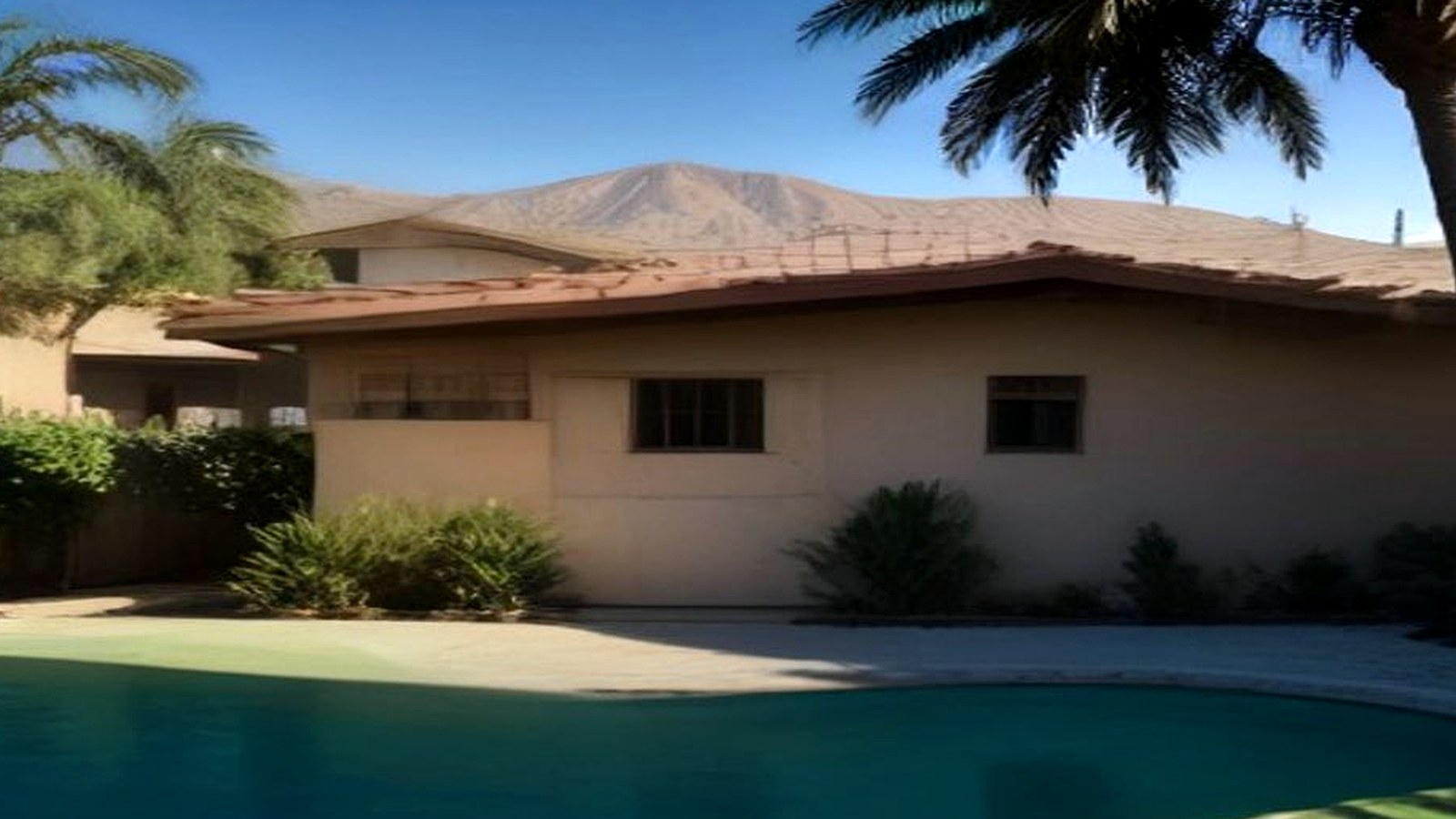 Photoreal architect reviewing custom home drawings for an Encino Los Angeles house, no logos