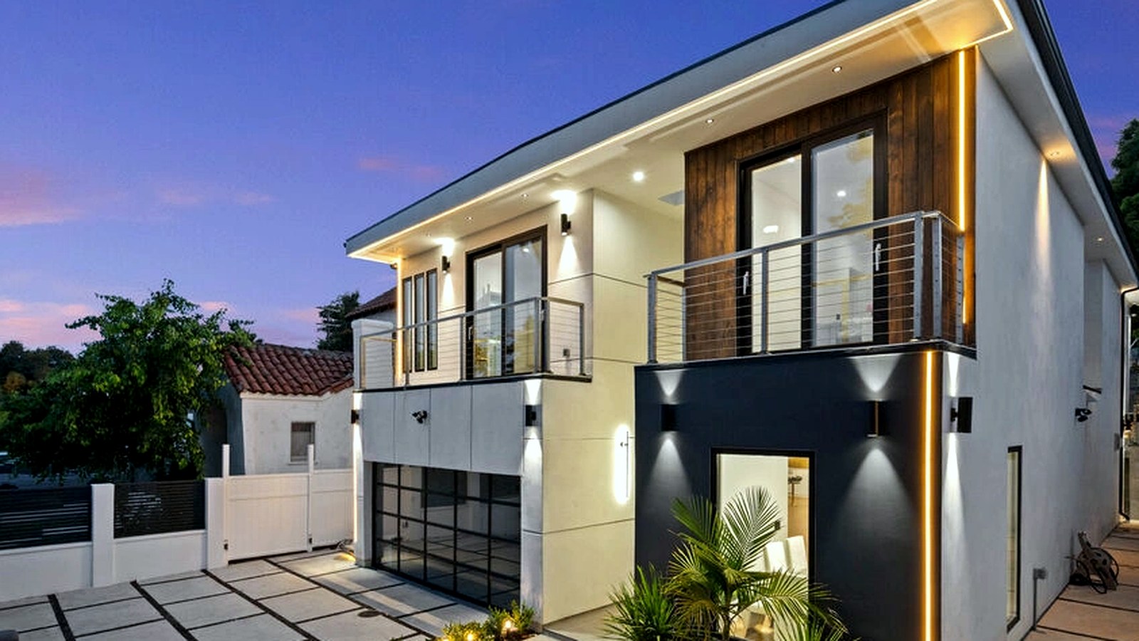 Photoreal plan review documents and custom home drawings on a table, no watermarks