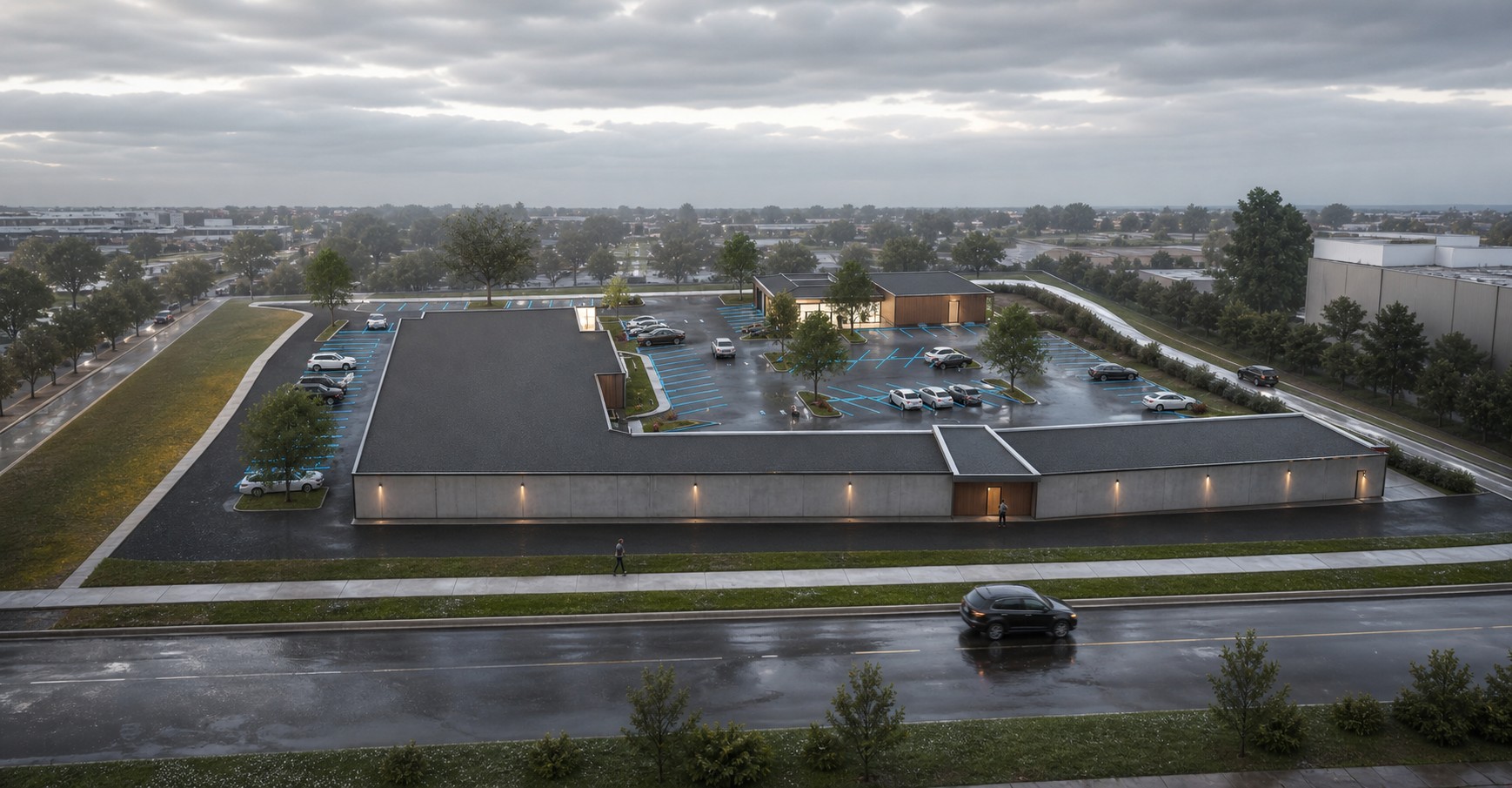 Aerial rendering of the long street-facing retail building and interior plaza parking