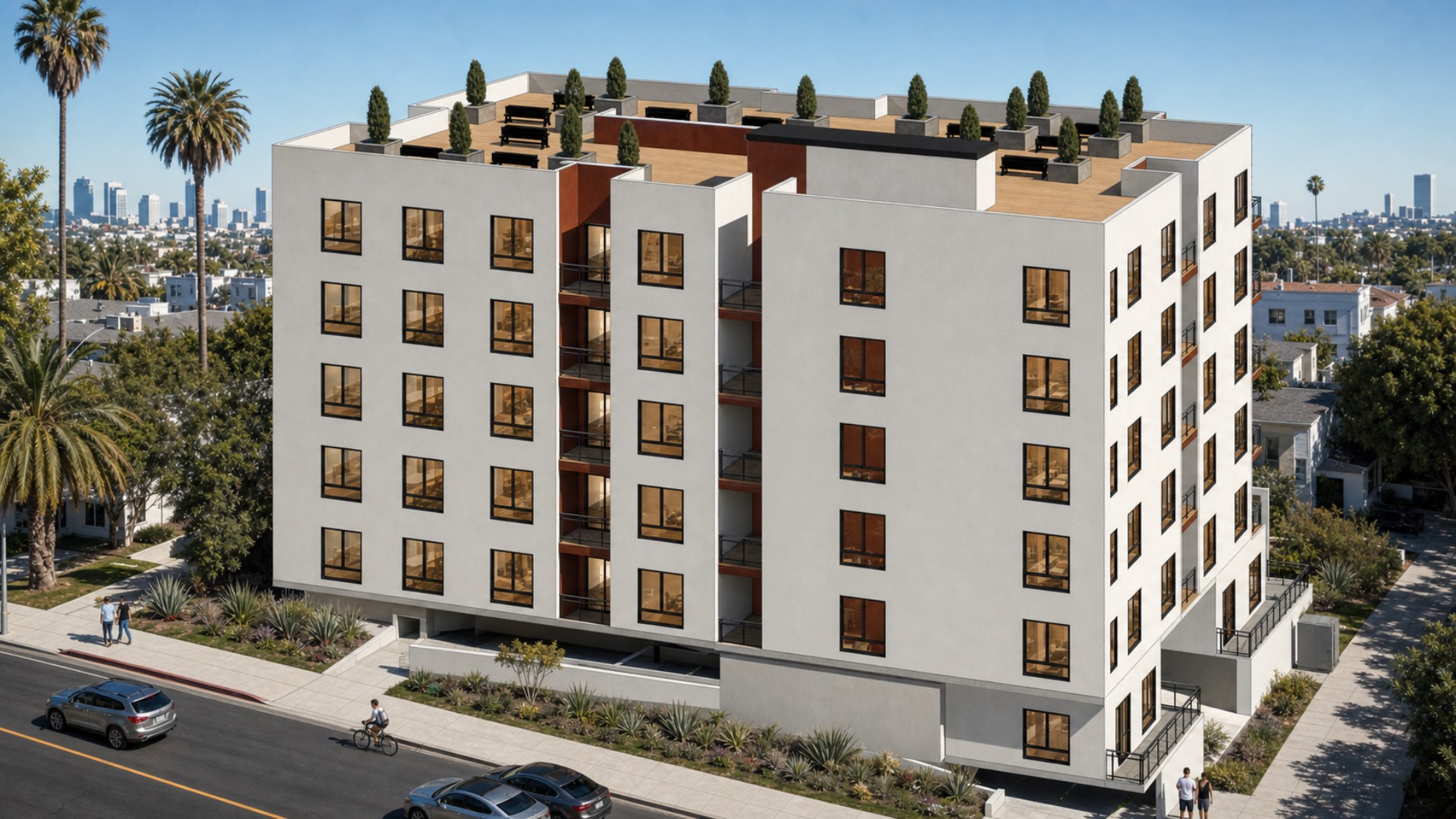 Rear aerial perspective of 812 Fuller Avenue with white exterior volumes, recessed balconies, rooftop seating, and Los Angeles skyline views