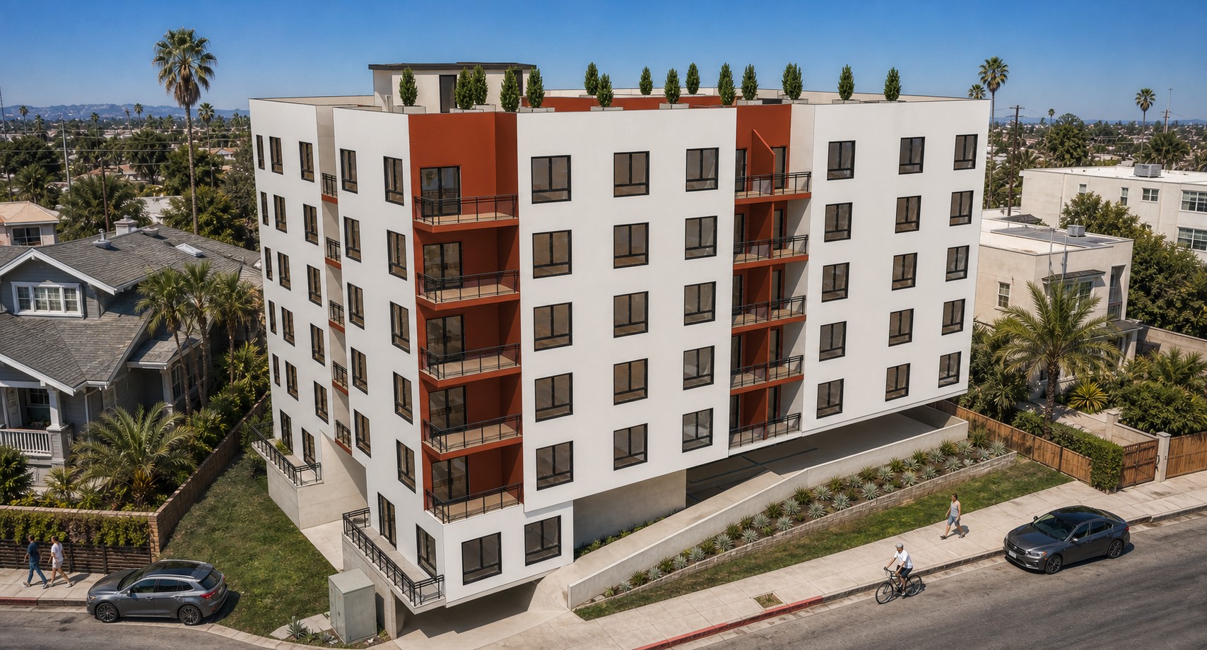 Elevated street view of 812 Fuller Avenue with white façades, red-brown balcony bays, black-framed windows, and rooftop landscaping