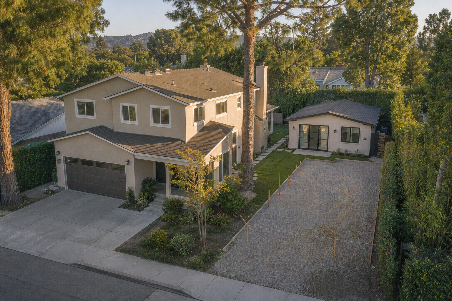 Encino single-family lot with a main house, one finished detached backyard ADU, and a staked empty pad where a second cottage would go