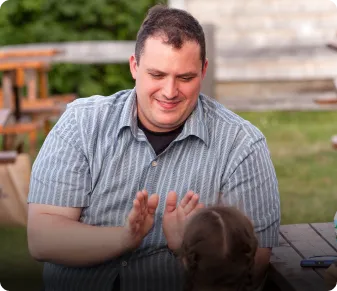 father playing with daughter