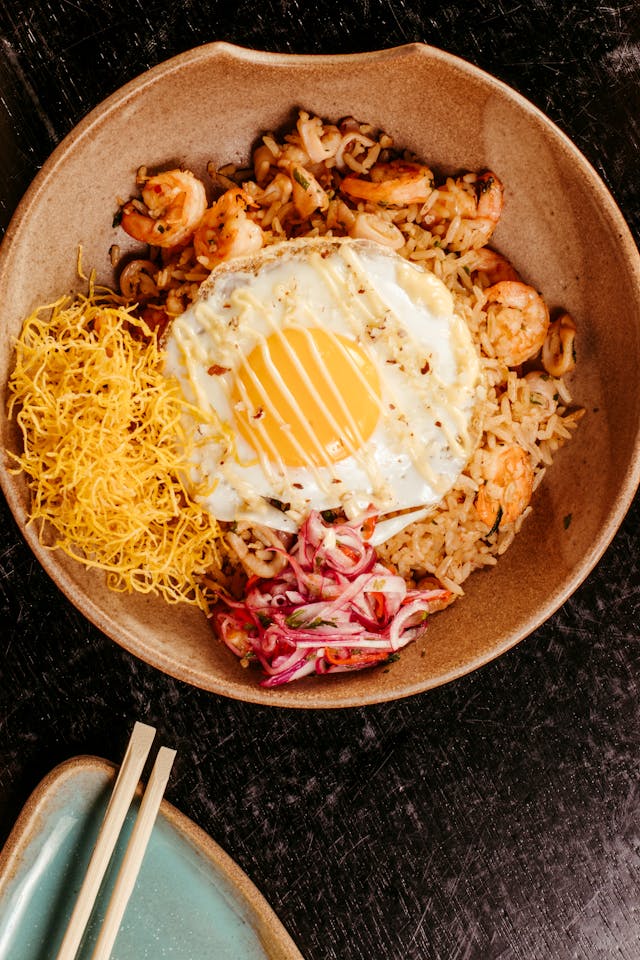 Asian dish with egg, rice, mushrooms and other vegetables.