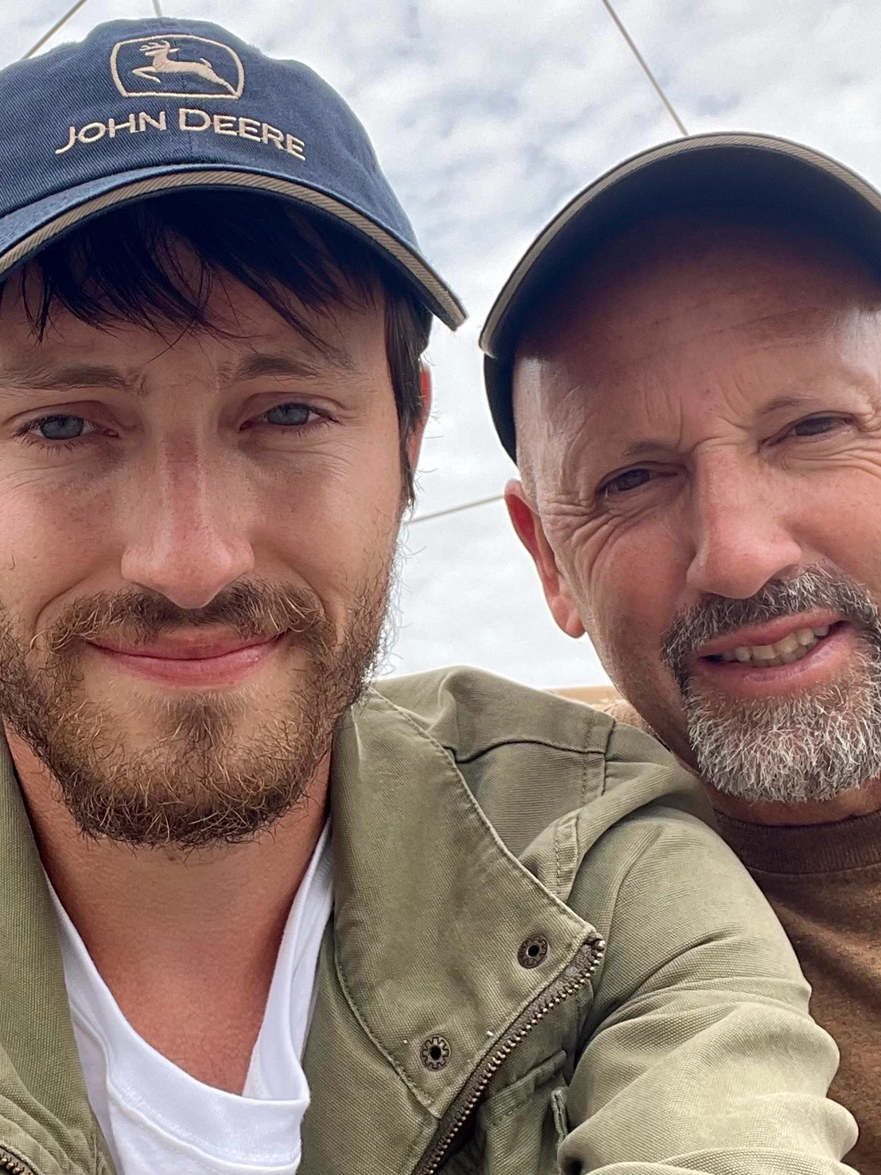 Father and son fishermen behind Hookd, pictured together on the boat during a fishing day.