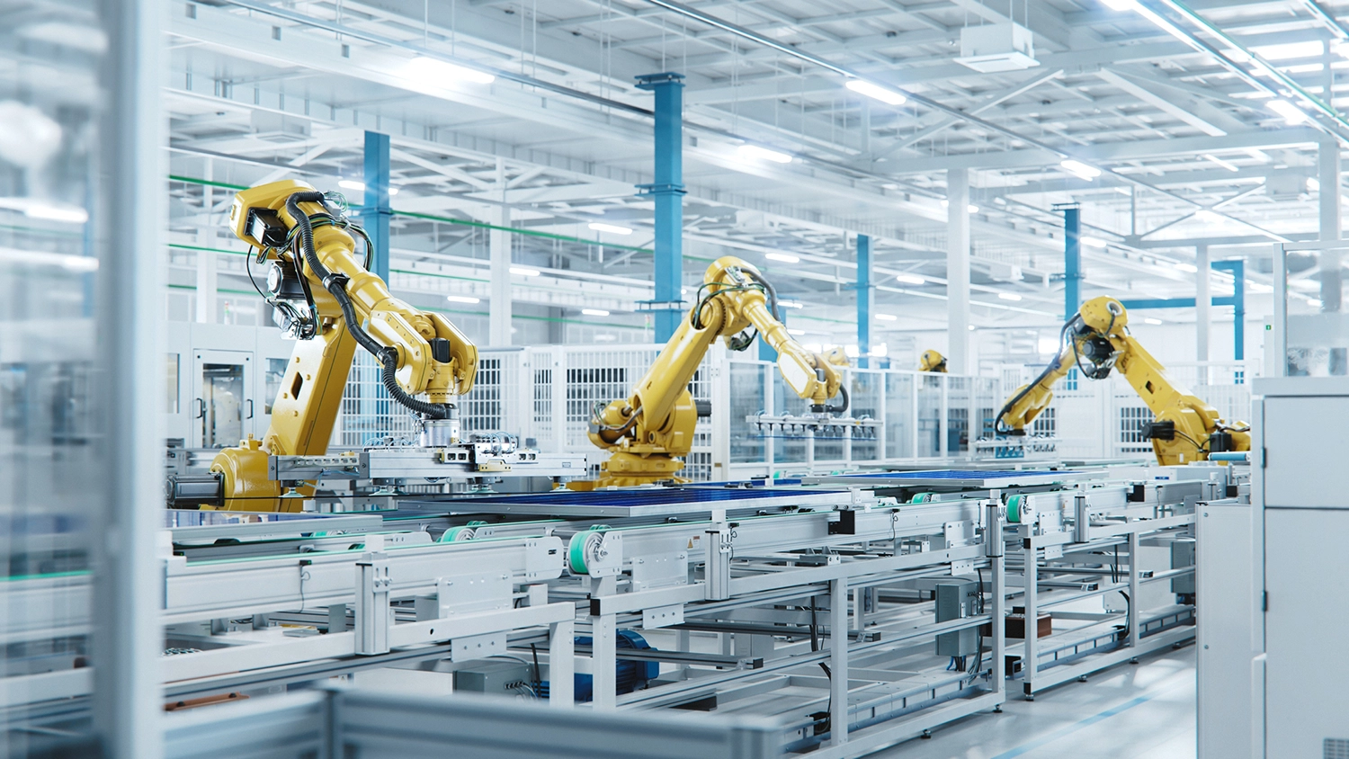 industrial robotic arms working on an automated assembly line in a factory