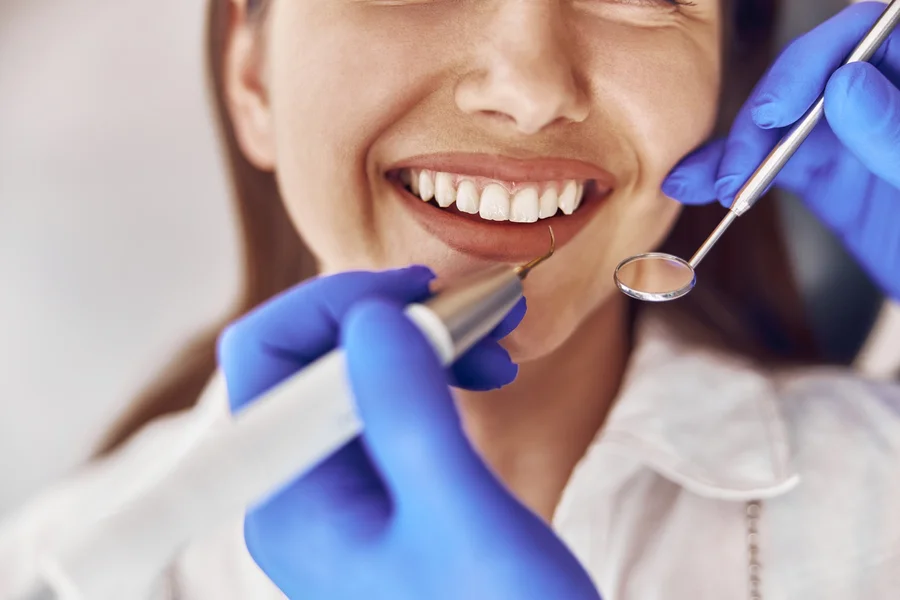 cosmetic-dentist-nj-closeup-of-teeth-cleaning-with-dental-tools