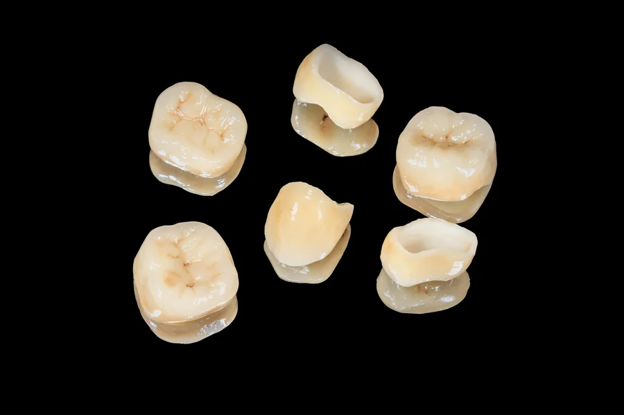 crown-dentist-nj-multiple-dental-crowns-black-background
