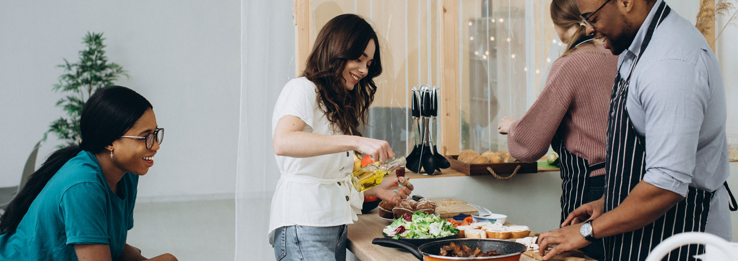 Friends preparting a meal together