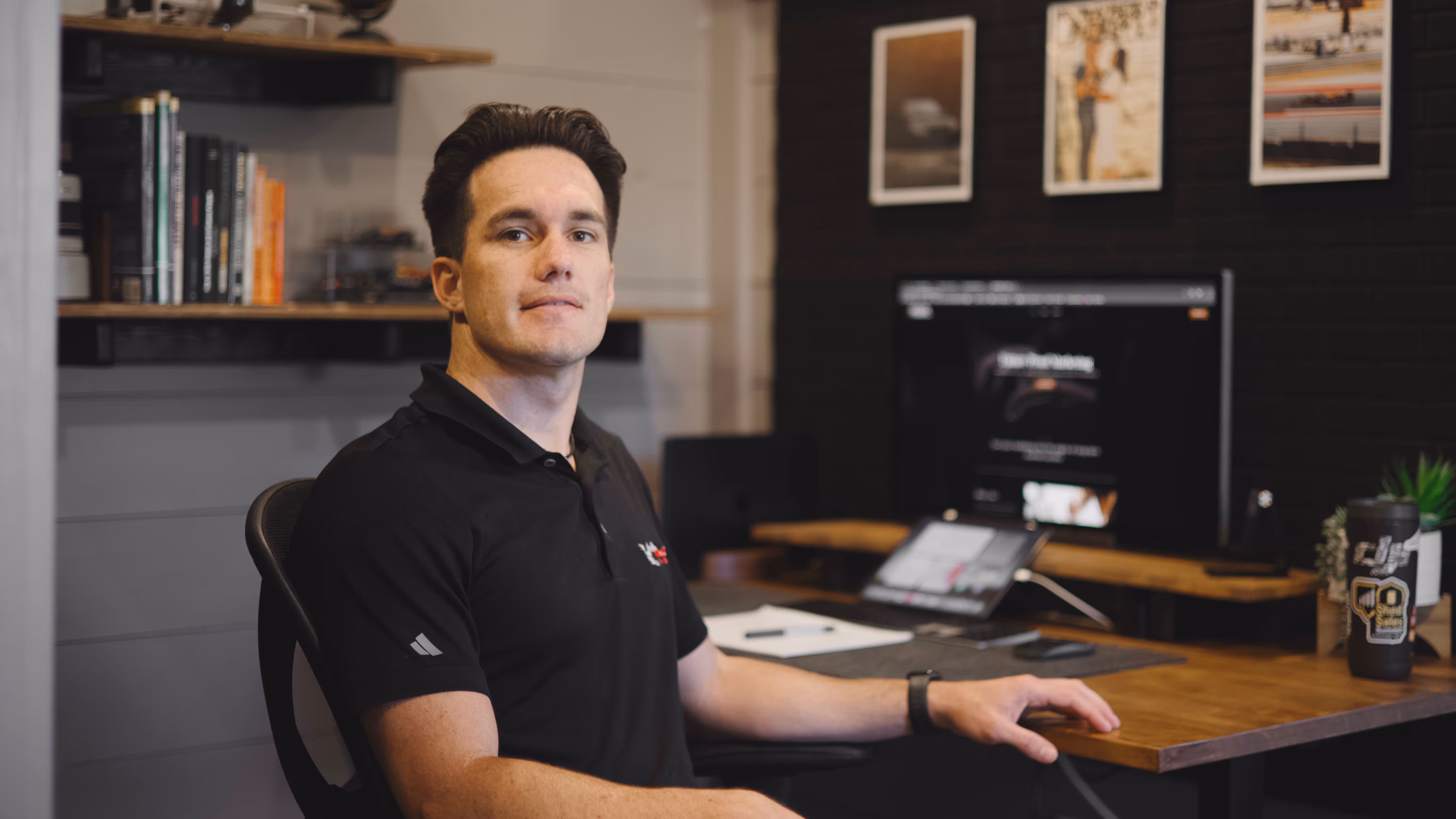 Galen Dueck sitting in front of his desk