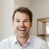 Professional headshot of Wileo consultant smiling in office setting