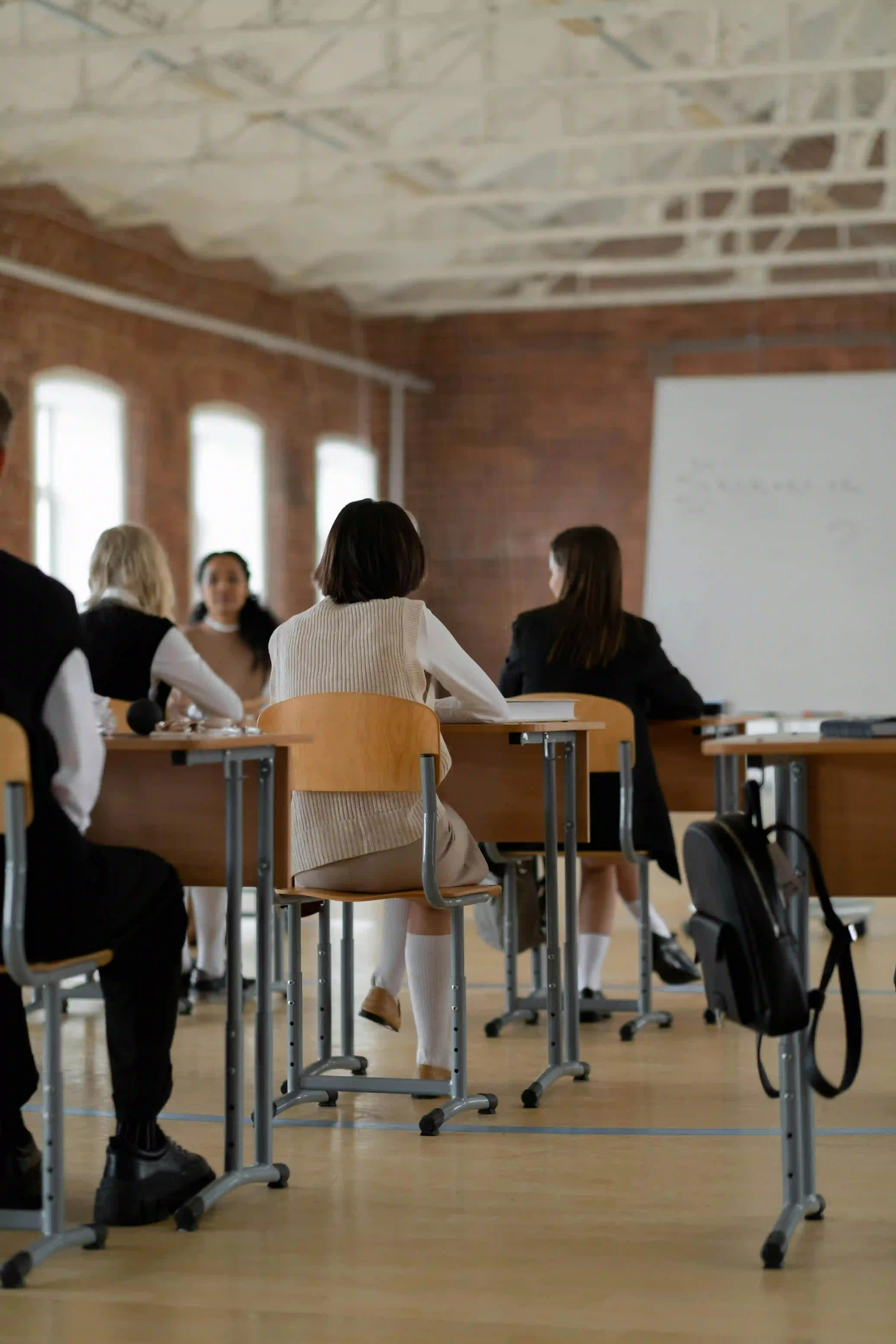 A group of students studying at individual desks.