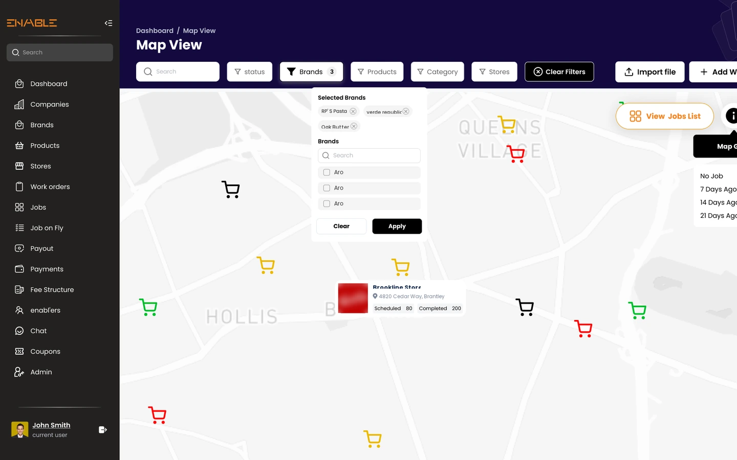 Map view of stores with per-location job status pins, a brand filter panel and a store card showing scheduled and completed counts