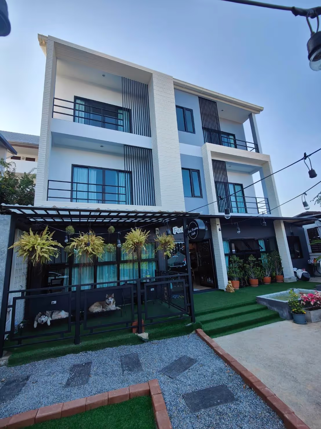 Image from the parking area of this three storey property with 4 bedrooms, 6 bathrooms, and a large, beautifully decorated