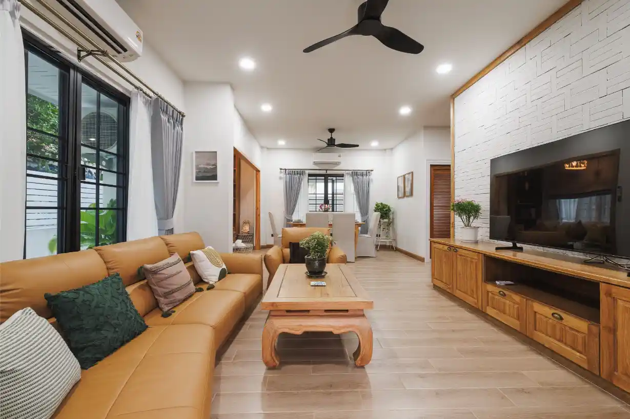Furnished lounge in the renovated San Sai home, with open-plan living and dining spaces.