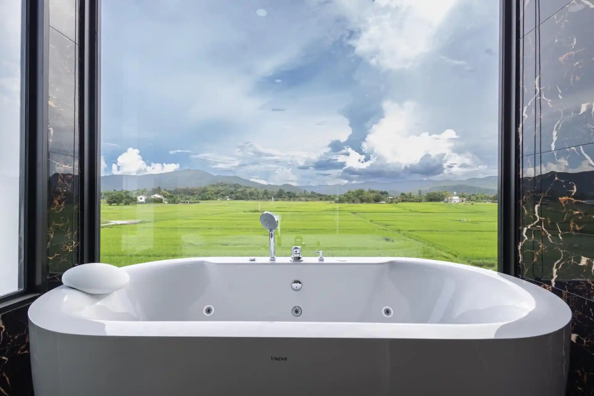 Luxury bathtub view overlooking emerald rice fields and mountains in Doi Saket, Chiang Mai - a 2026 wellness real estate investment.
