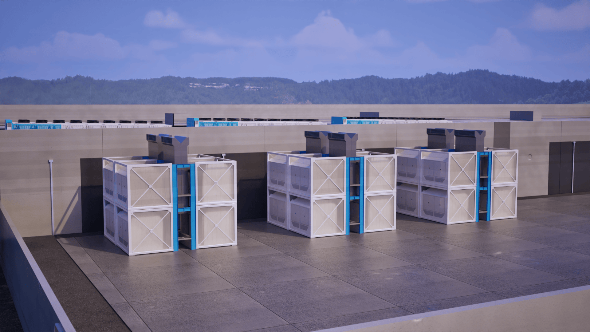 Three large industrial HVAC units with blue vertical connectors mounted on a rooftop against a background of hills and blue sky.