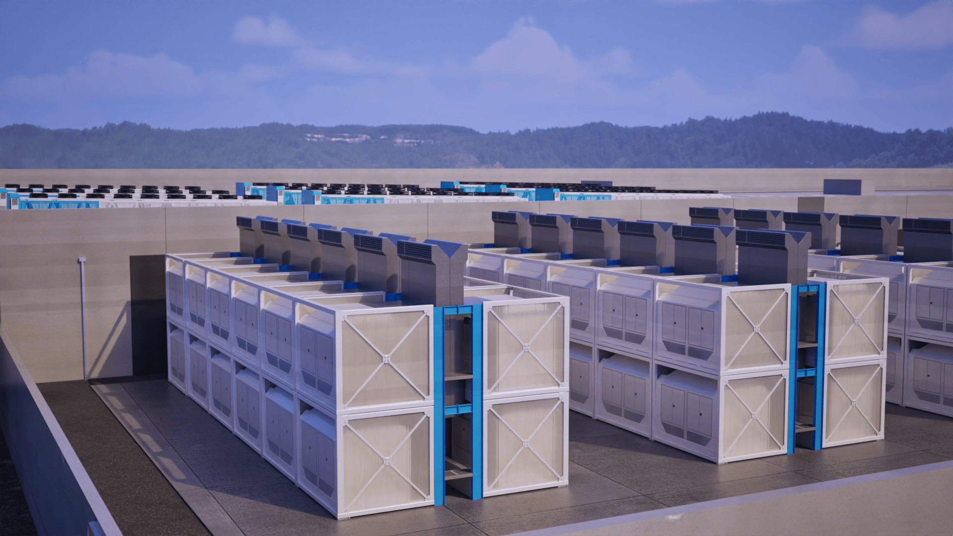 Rows of large industrial air conditioning or cooling units on a flat rooftop under a blue sky with distant tree-covered hills.