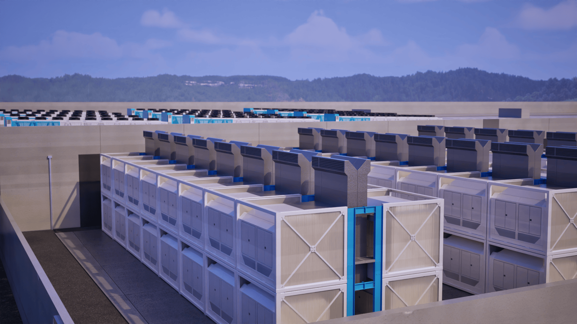 Rooftop view of large industrial HVAC units with blue accents under a partly cloudy sky.
