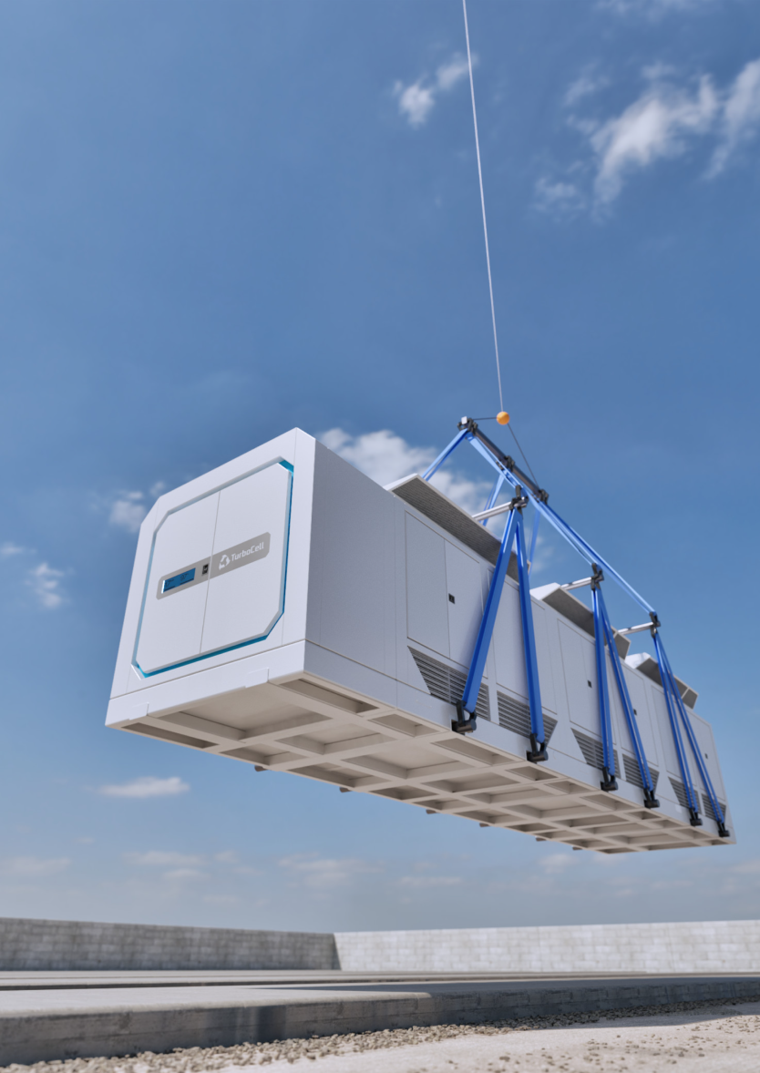Large white TurboCell unit being lifted by a crane against a blue sky background.