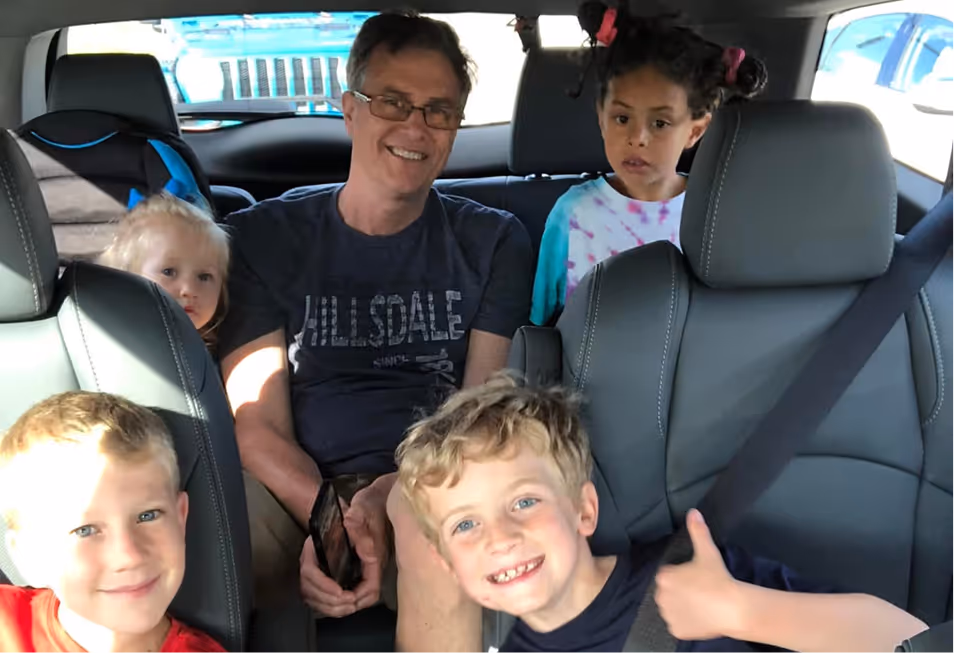 Mark Suerth with his wife and children, showing strong family values and community commitment.
