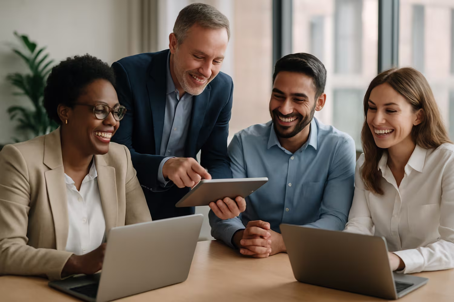 Diverse business team utilizing technology