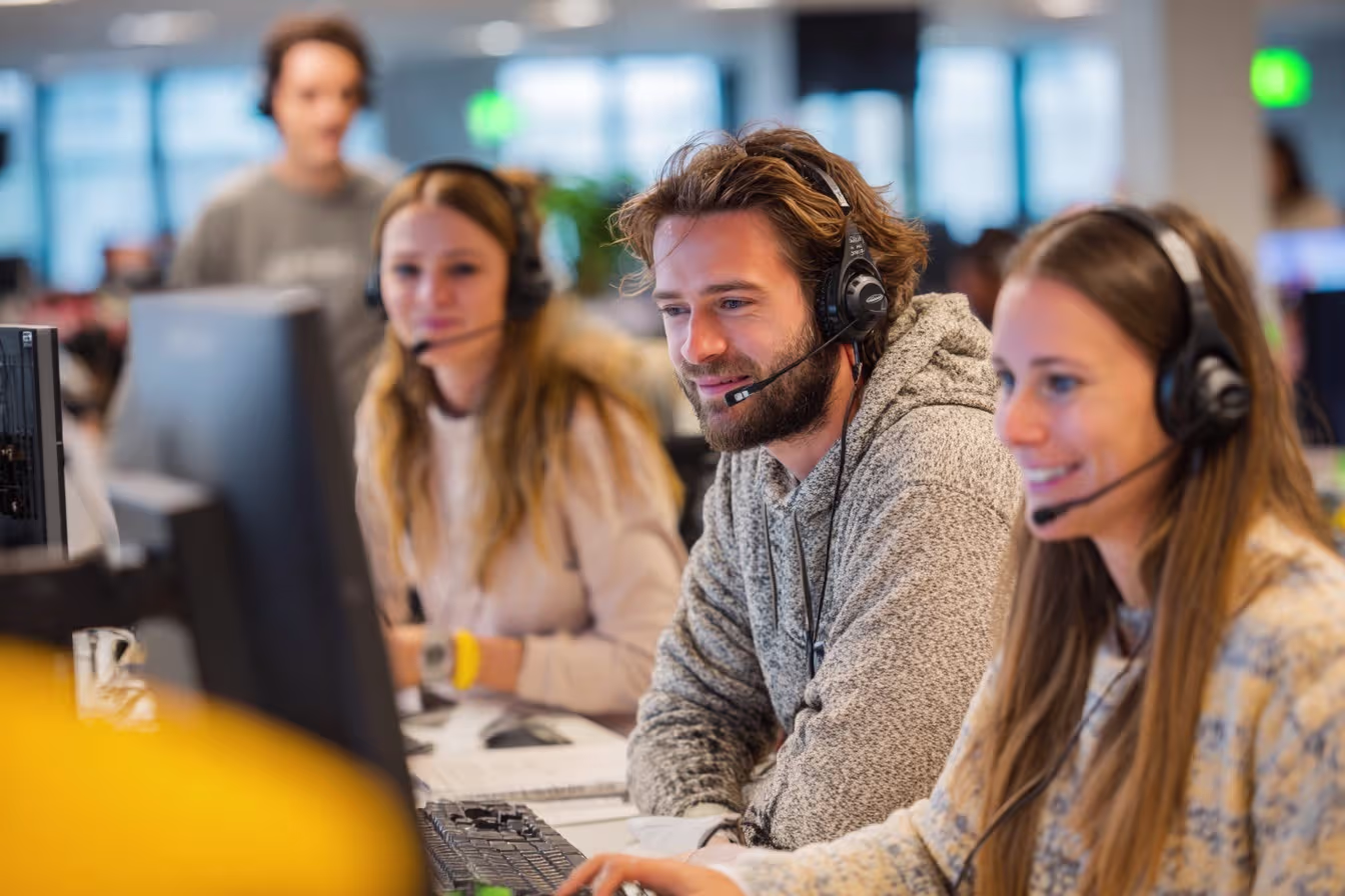 Help desk team collaborating in-office