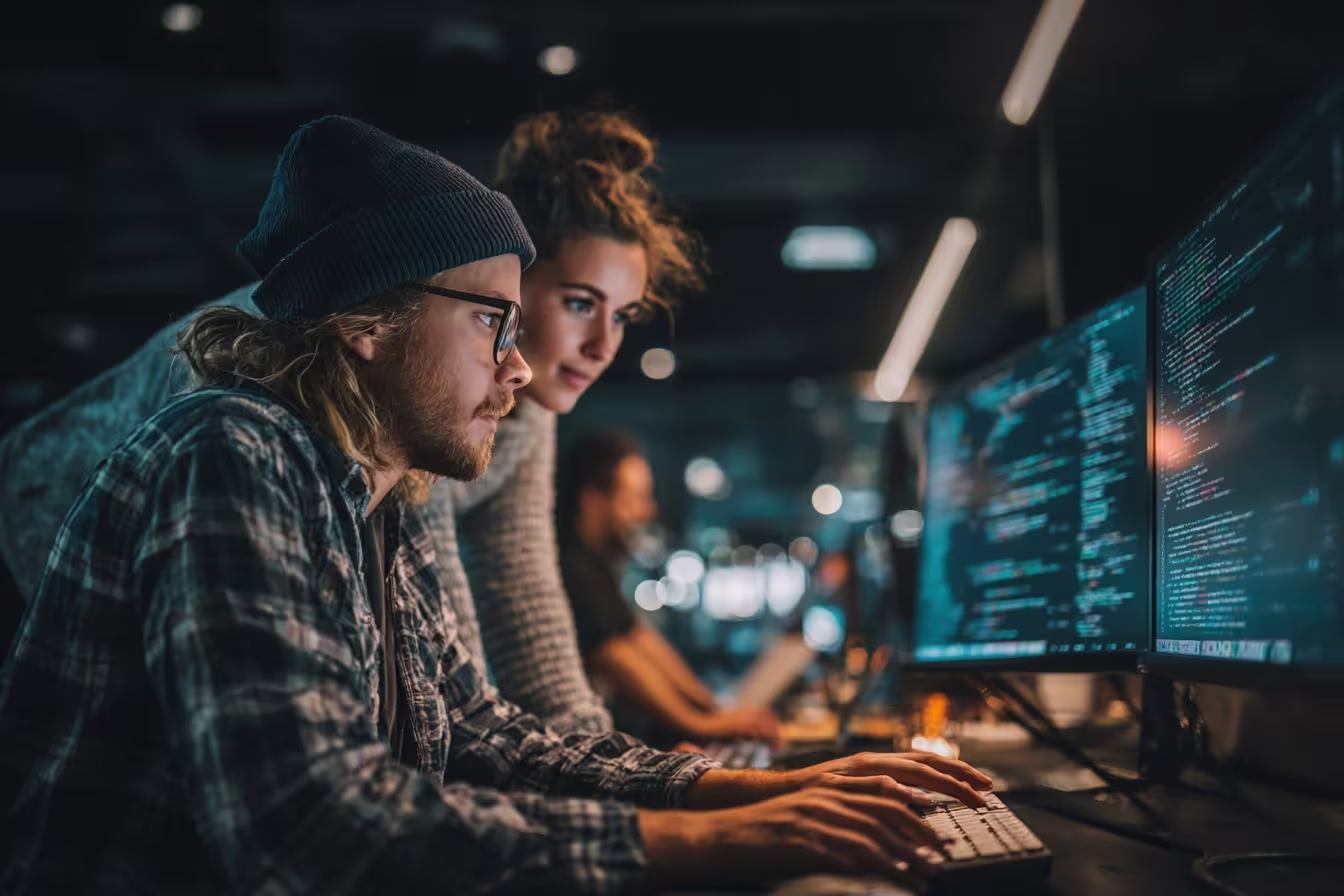 IT professionals collaborating on technical tasks