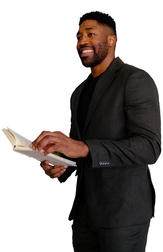 Meech Robinson (Meech) man in a dark suit holding  a book.