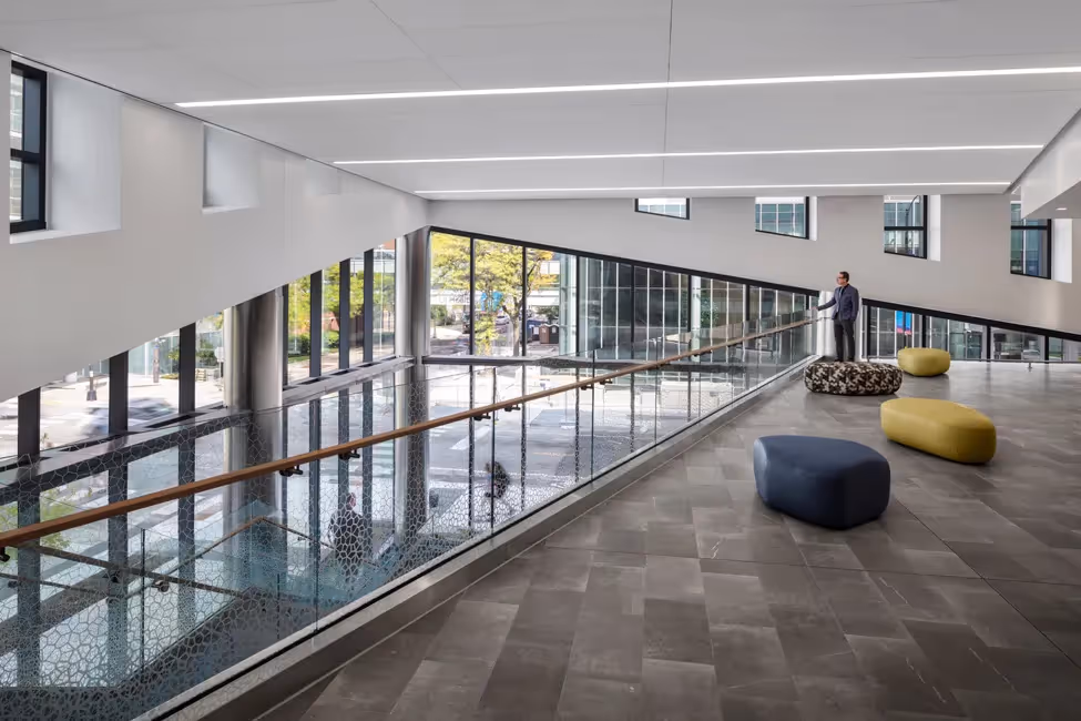 A man stares somewhere while standing in a building.