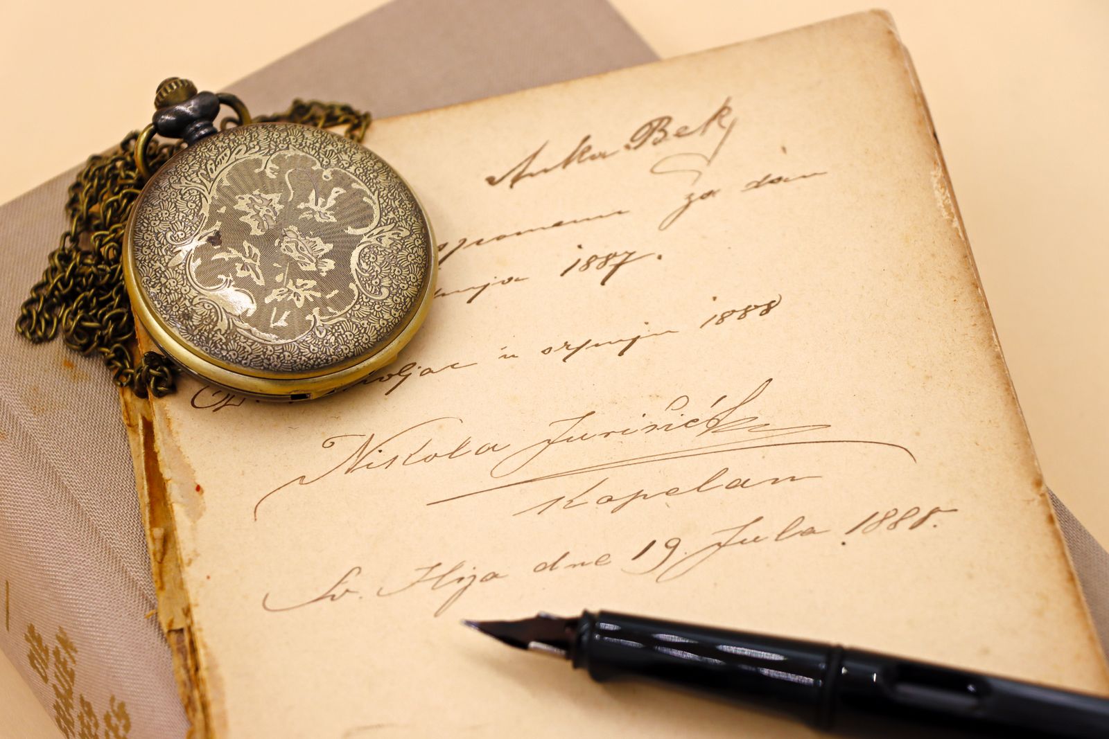 Handwritten letter, pocket watch and fountain pen