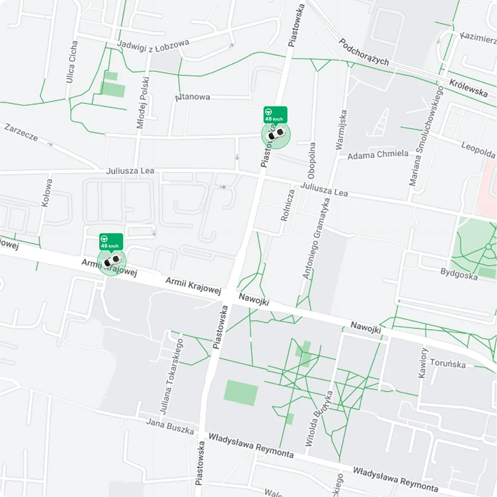 FleetOnAir map view showing real-time vehicle locations and speed indicators.