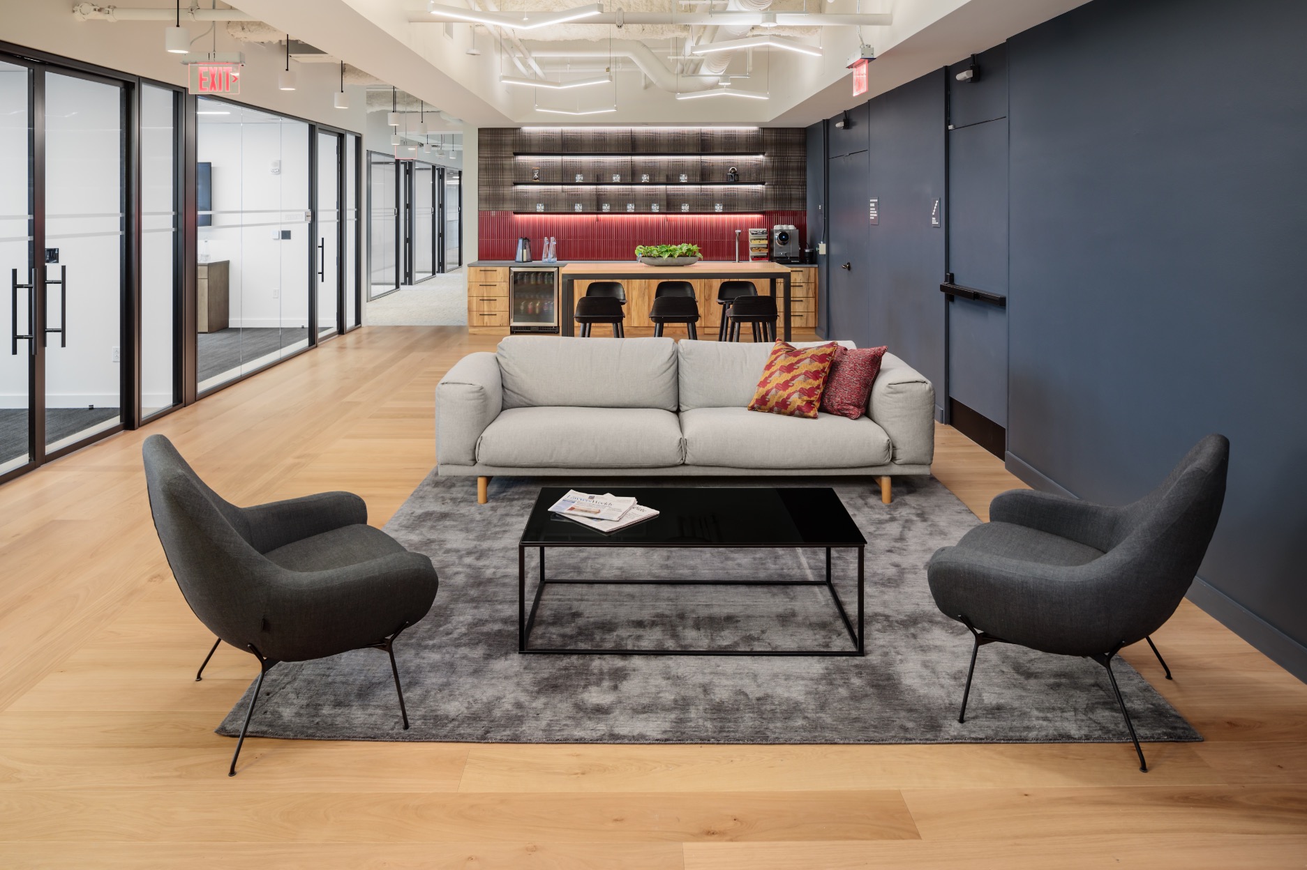 Modern lobby with a couch and two chairs