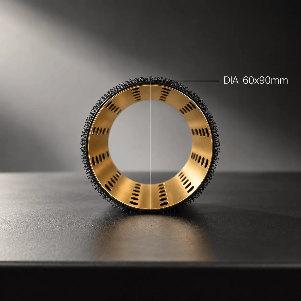 Close-up front view of a gold-colored hollow cylindrical hair curler with black mesh outer surface, showing ventilation holes inside and labeled with diameter measurement 60x90mm.