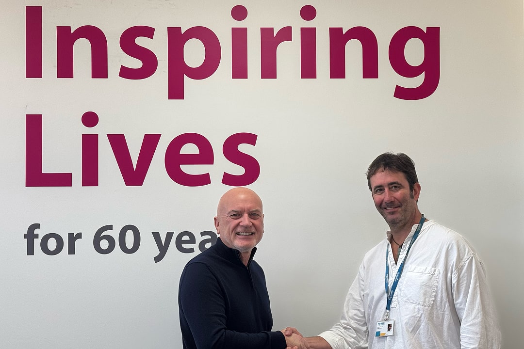 Graham Haynes, Head of Homes at Squared, shaking hands with employee of Mammoth Equipment Ltd