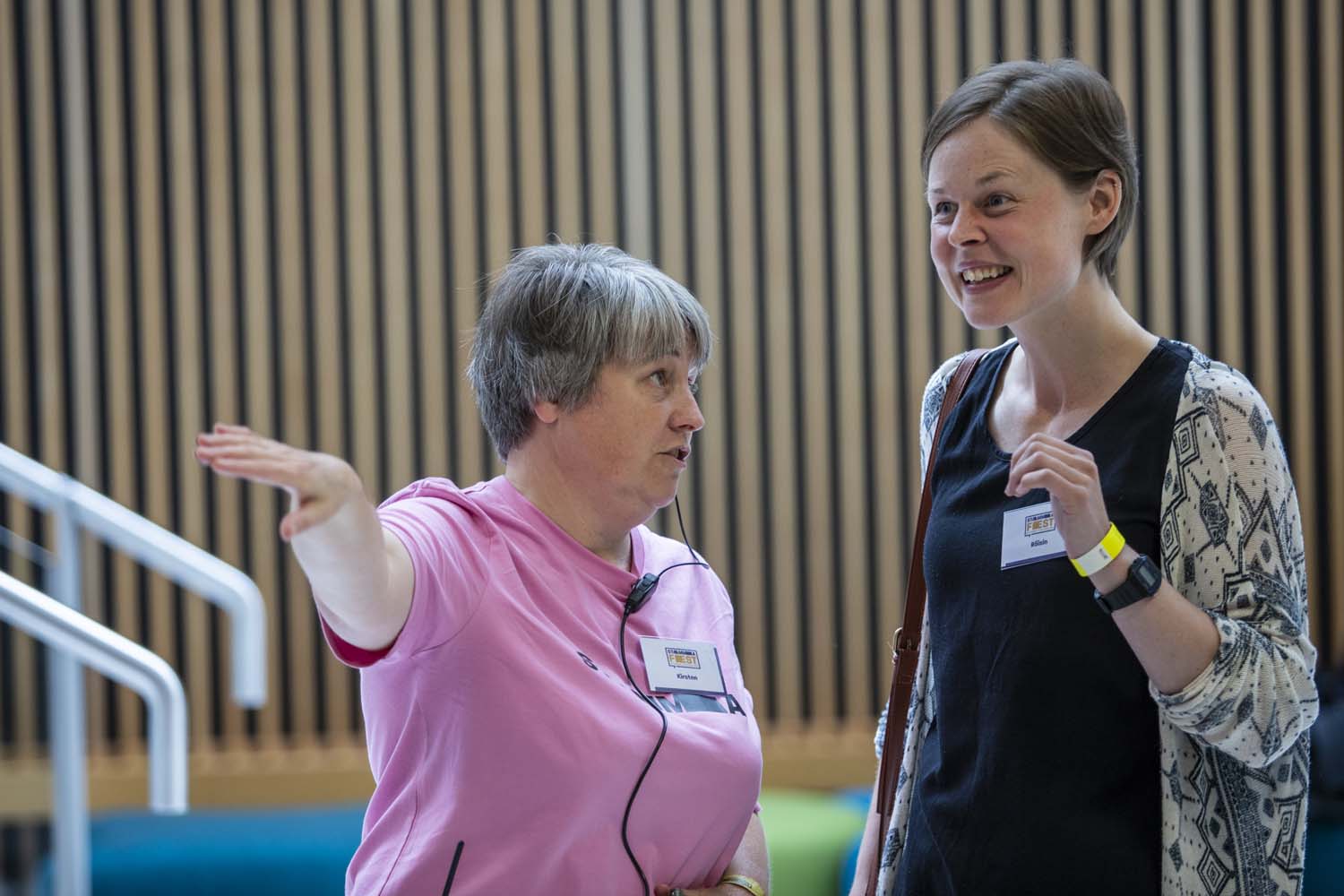 Kirsten giving directions to woman