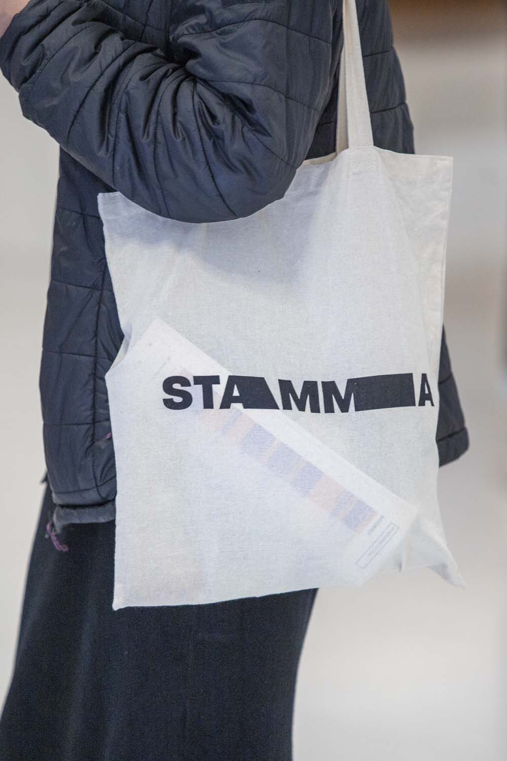 Person holding Tote bag (close up)