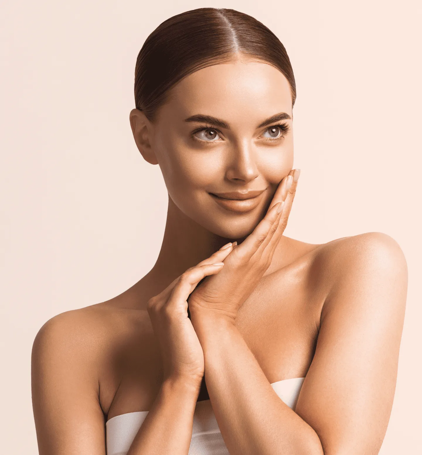 A woman in a strapless top posing for a picture.