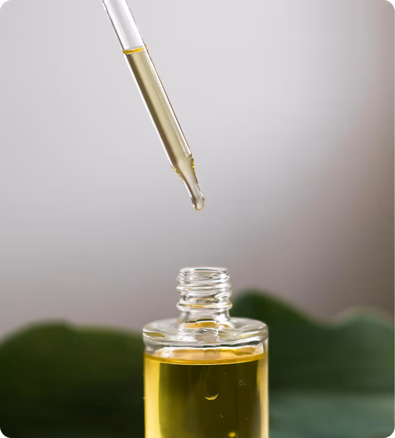 Drooping the oil from the pipette into the bottle