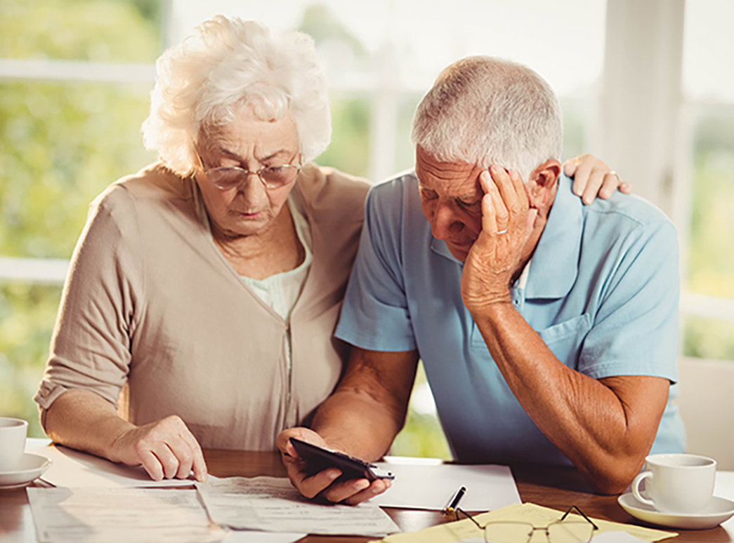 An older couple looking at their finances