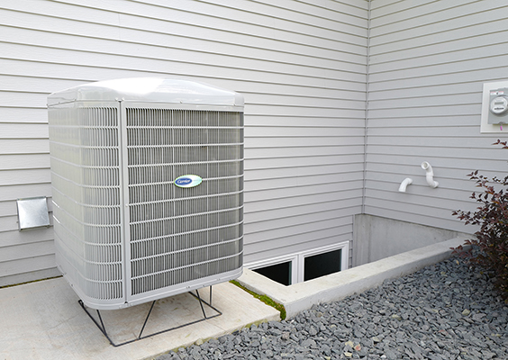 An air-source heat pump outside a home